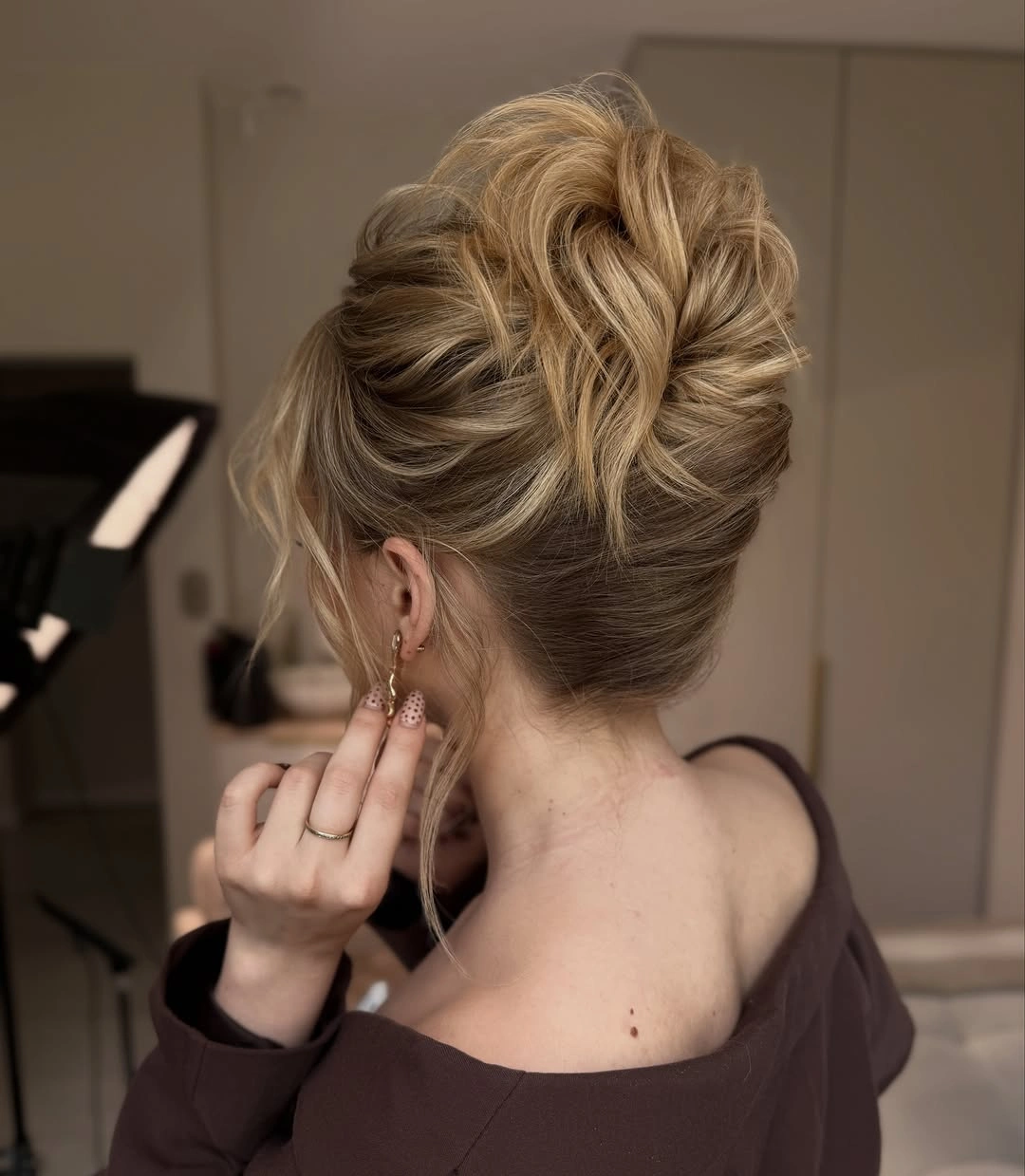 fall hairstyles for wedding guests 2026 Soft Voluminous High Bun