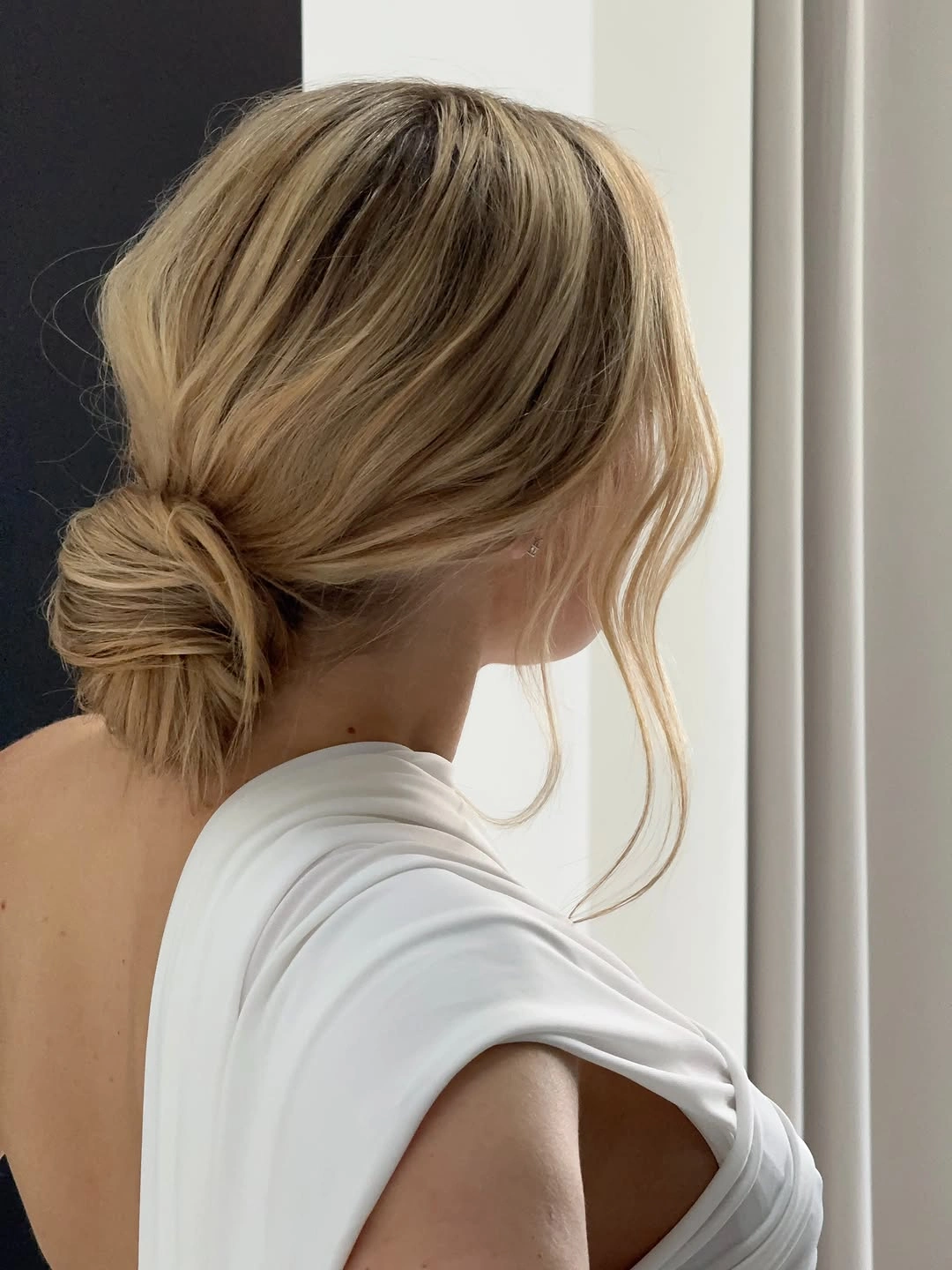 fall hairstyles for wedding guests 2026 Low Twisted Bun With Natural Softness