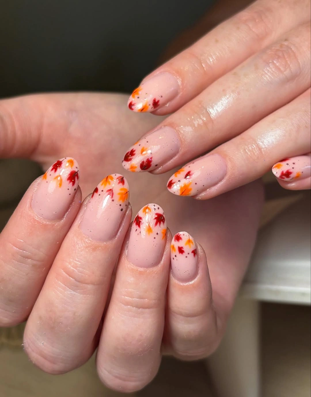 fall medium nail ideas 2026 Delicate Autumn Leaves On A Barely-There Nude Base