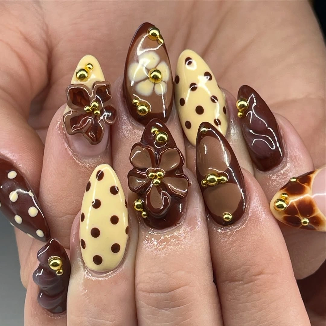 fall medium nail ideas 2026 Chocolate Floral Nails with Vintage Charm Details
