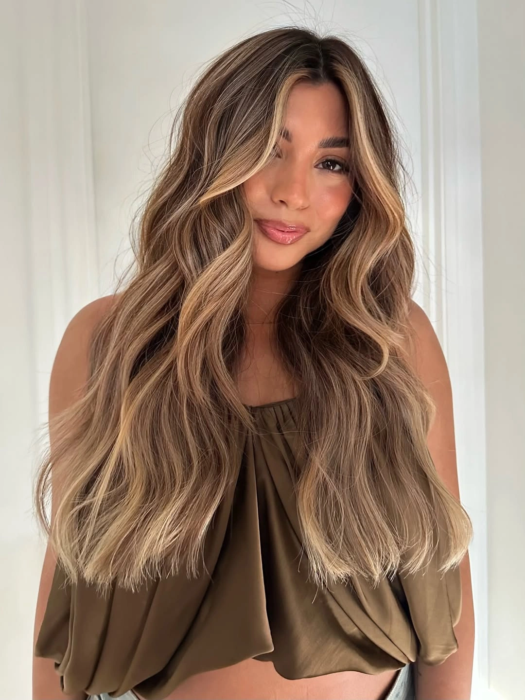 hair lowlights: color ideas and inspiration Smoky Beige Lowlights With Beachy Movement