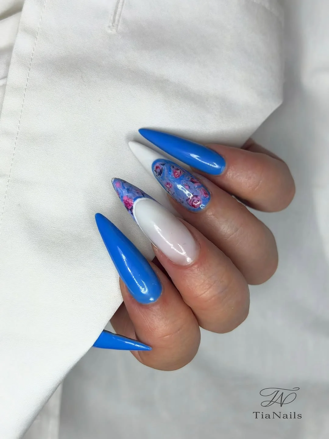 nail ideas for august 2026 Bold Blue Floral Stiletto Summer Nails