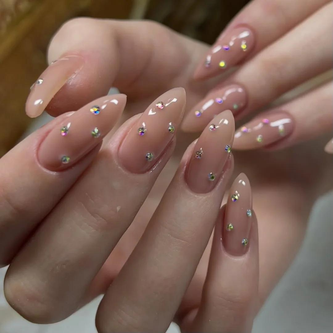 nail ideas for august 2026 Nude Almond Nails With Crystal Details