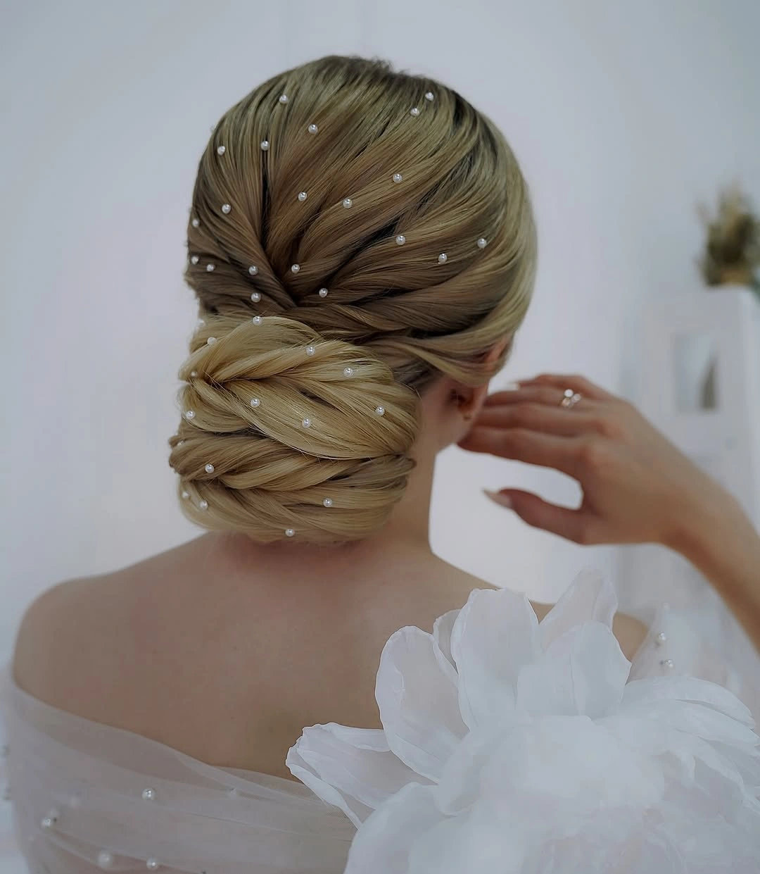 september hairstyles ideas 2026 Low Textured Bun With Delicate Pearl Details