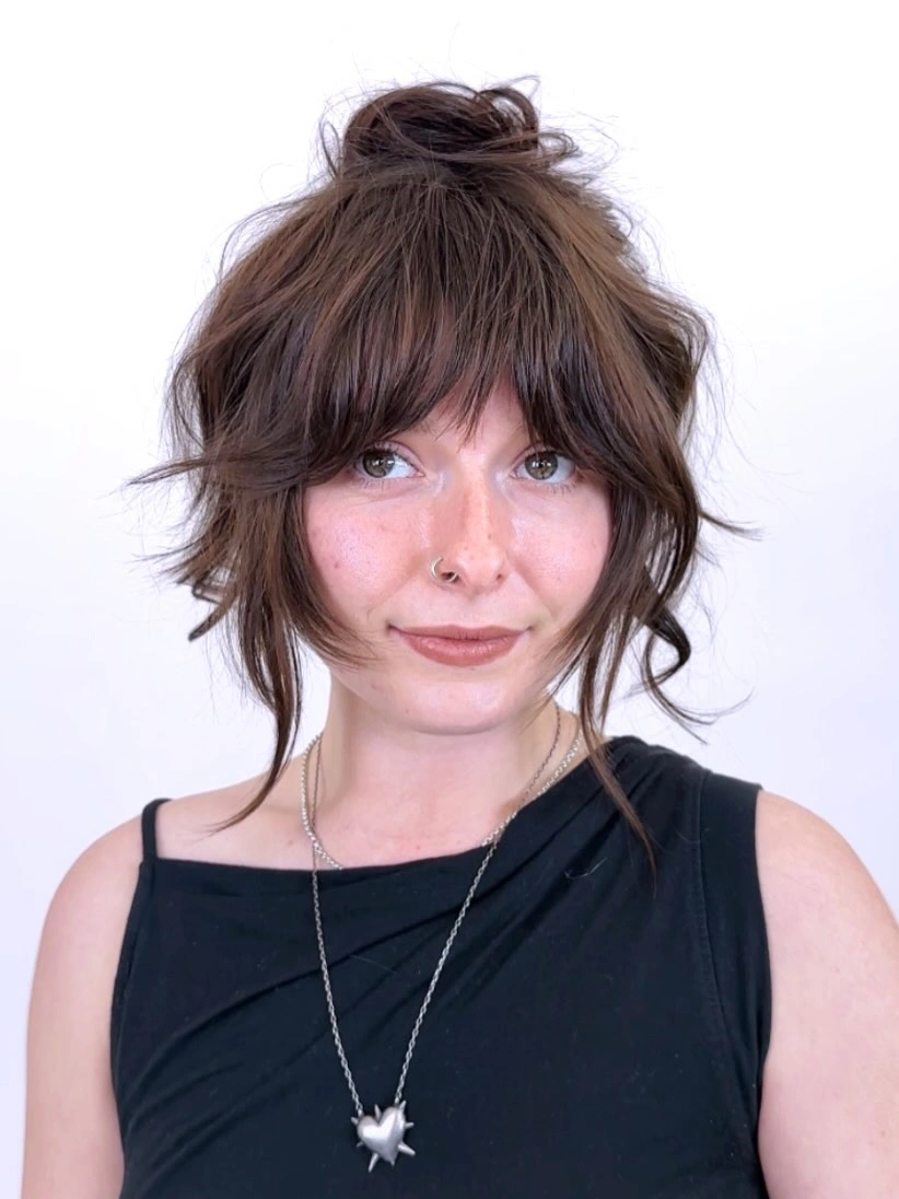 september hairstyles ideas 2026 Messy Top Knot With Short Layers