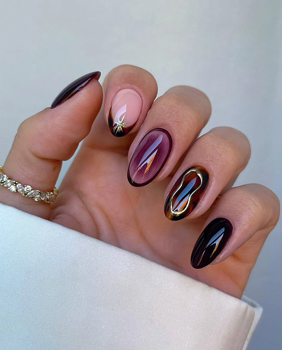 september nails color 2026 Deep Plum With Gold Accent Details