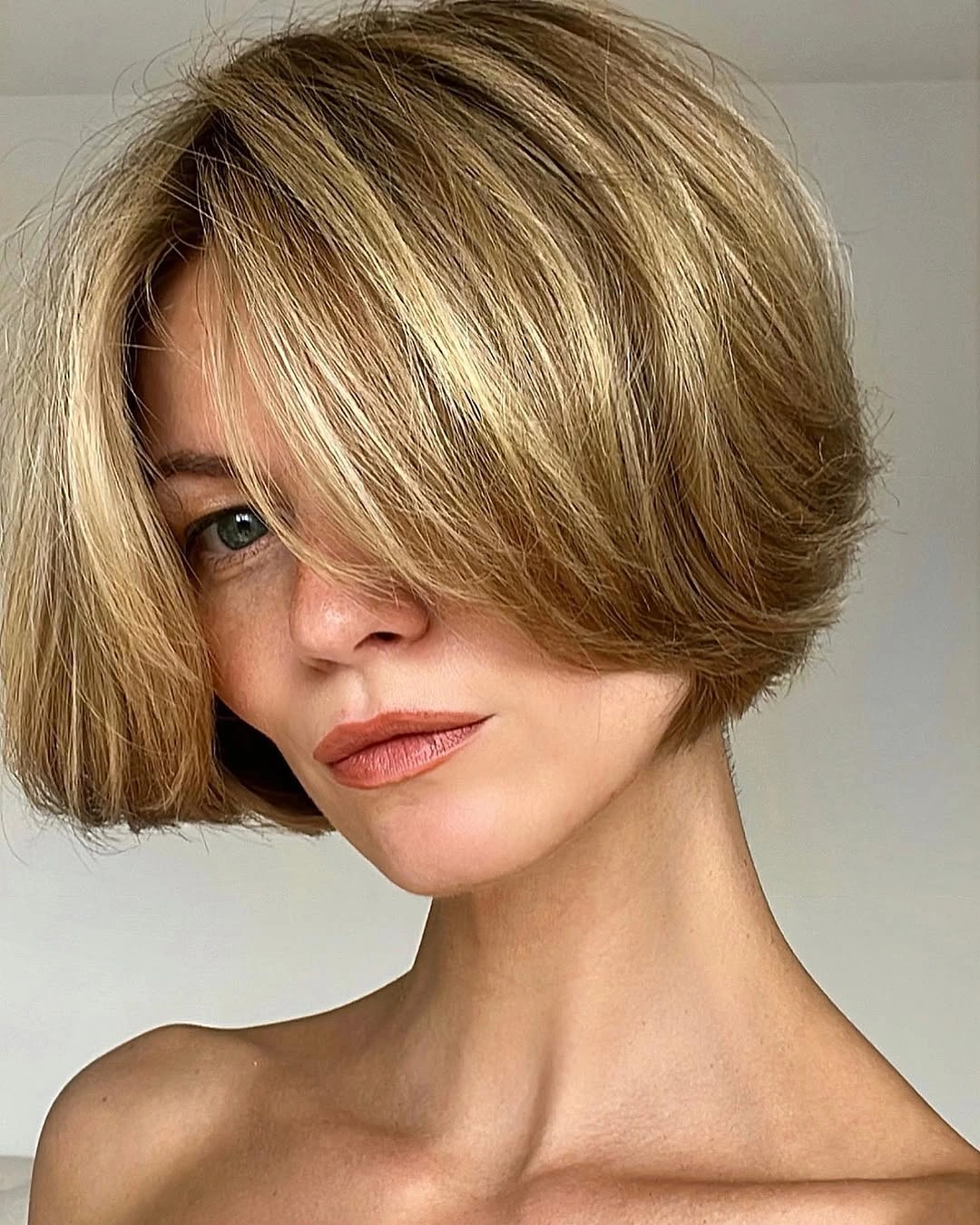 short bobbed hairstyle Soft Blonde Bob With Long Curtain Bangs