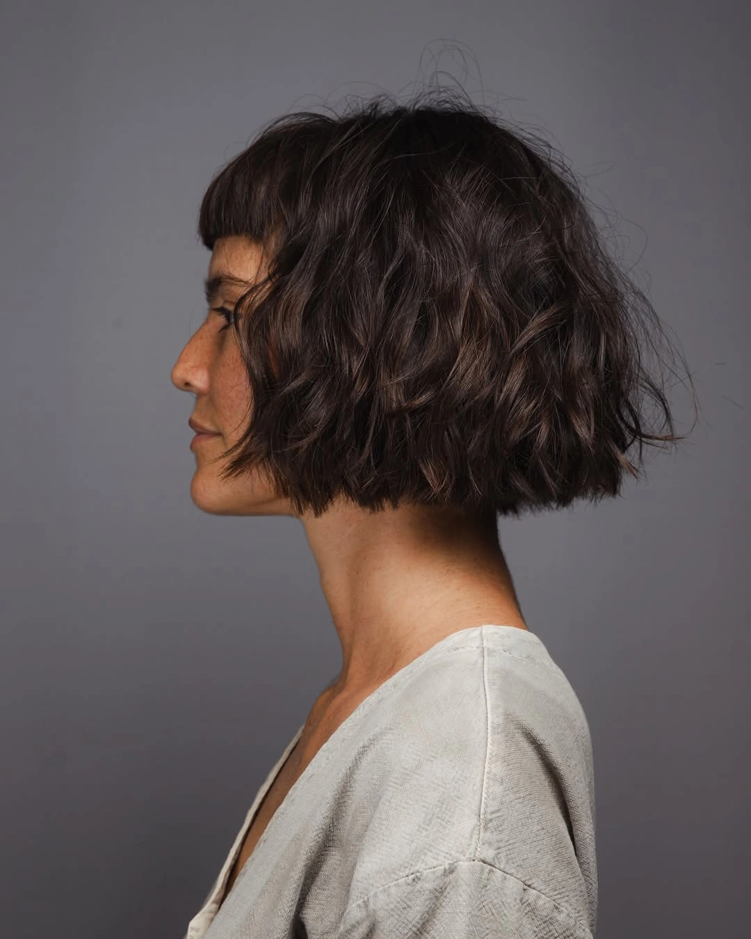short bobbed hairstyle French Inspired Wavy Bob With Micro Fringe