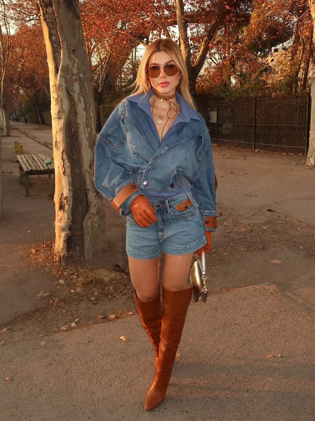 warm weather fall outfits 2026 Denim On Denim With Tall Leather Boots