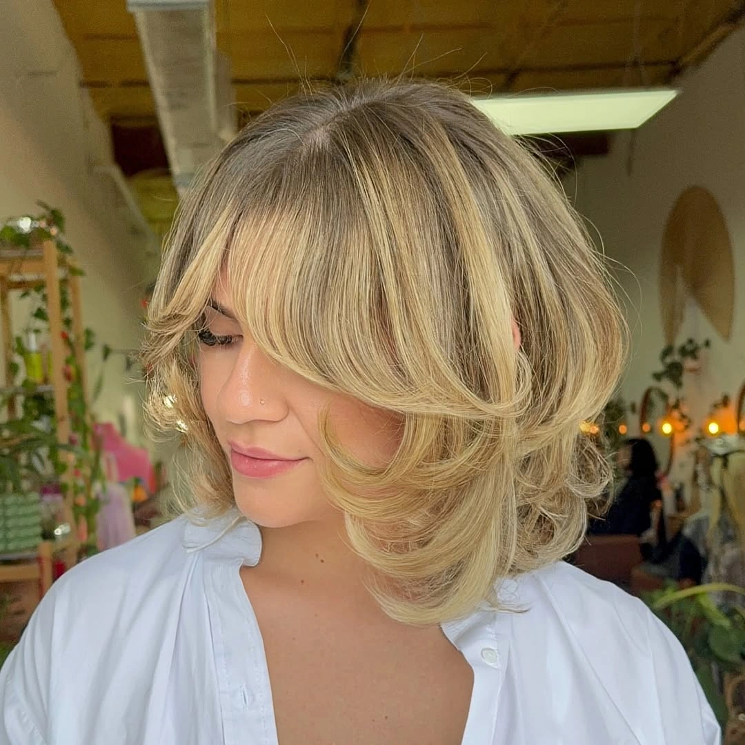 bob with layers haircut - Blonde Shoulder-Grazing Bob With Feathered Ends