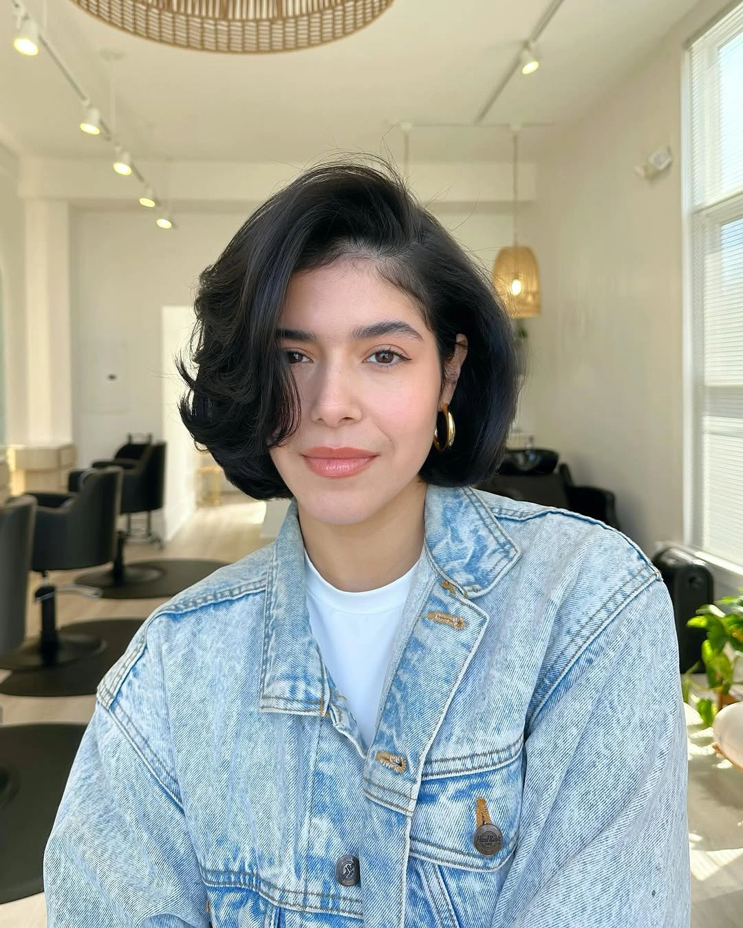 bob with layers haircut Voluminous Black Bob With Side Swept Layers