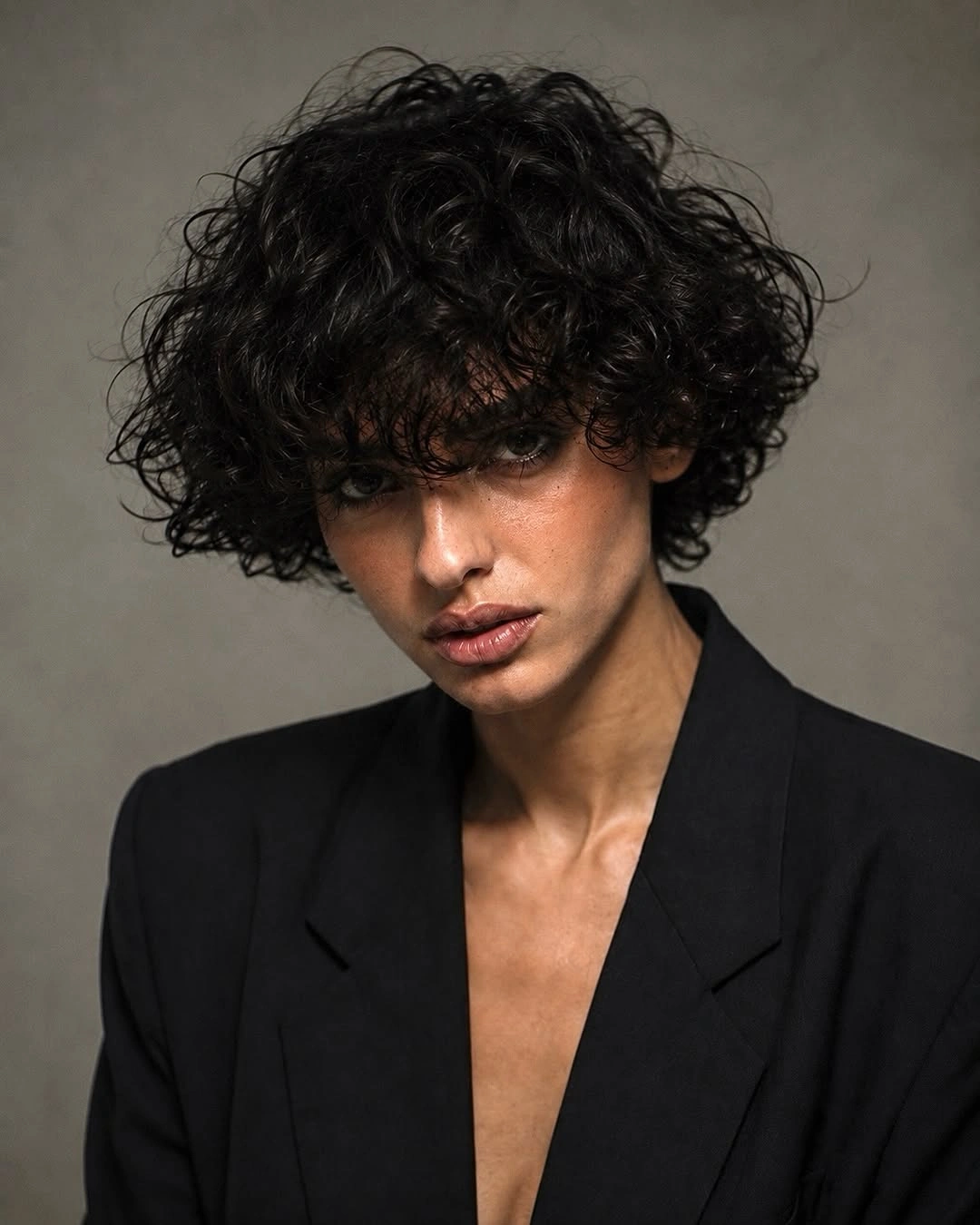 curly bob haircut Inky Curly Bob With Soft Bangs