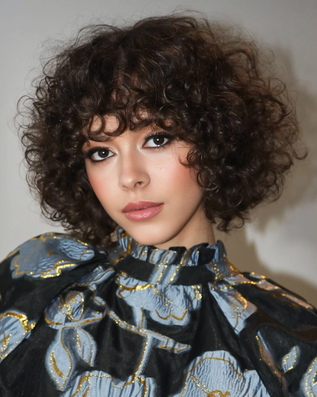 curly bob haircut Dark Curly Bob With Full Bangs