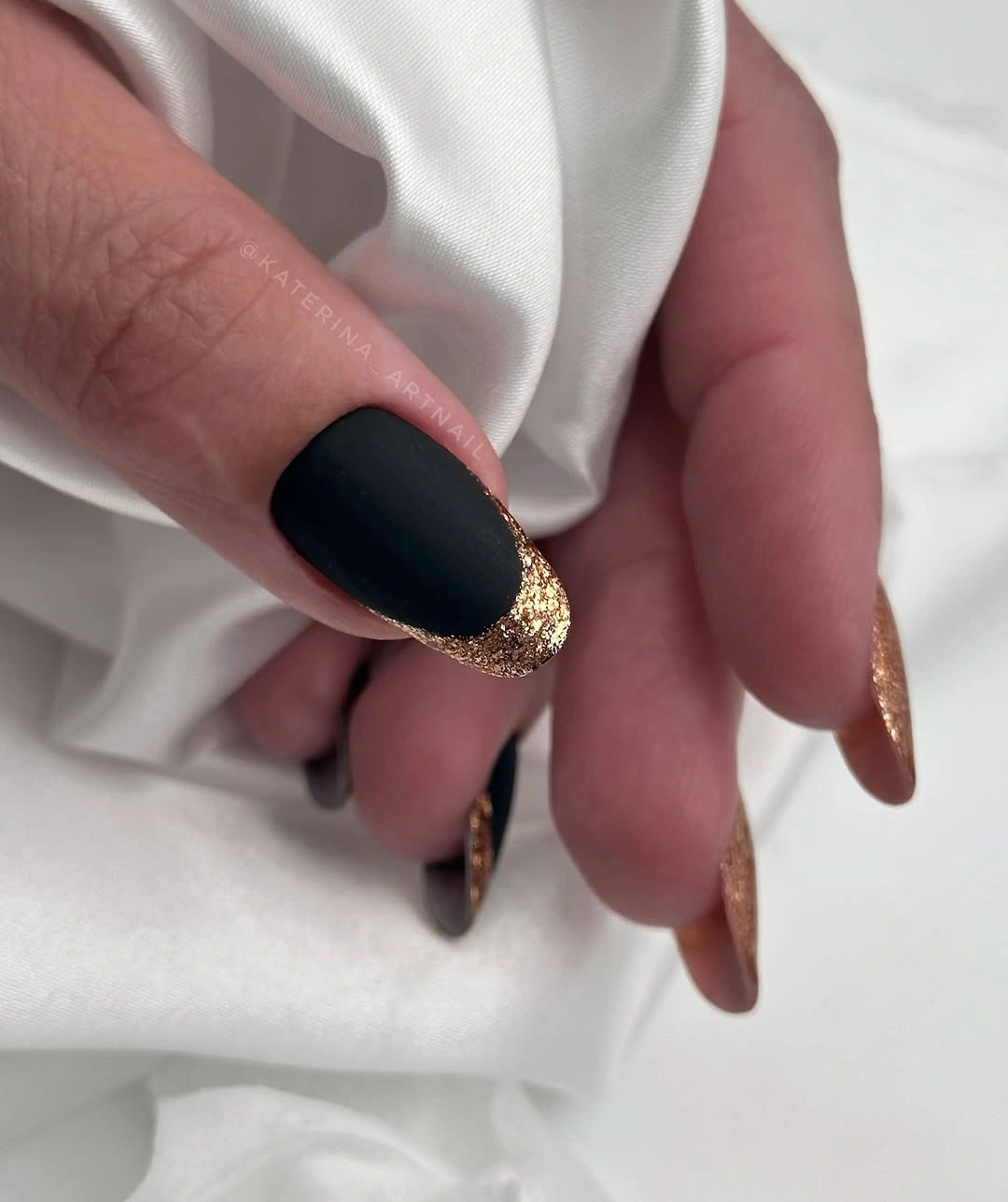 dark fall nails 2026 Matte Black With Gold Glitter French Tips