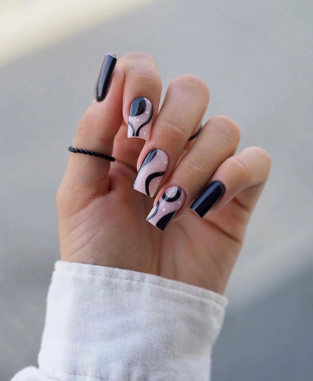 dark fall nails 2026 black sheer pink swirl nail art