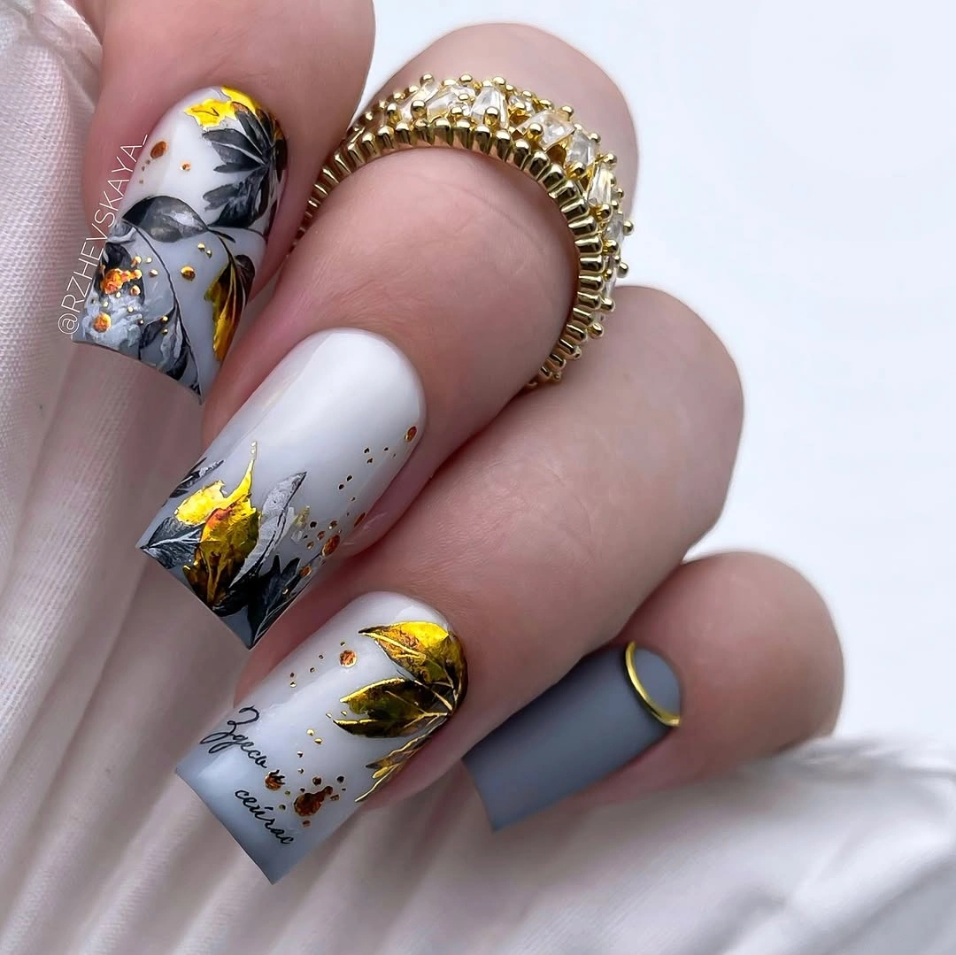 early fall nails 2026 Autumn Leaf Nails With Gold Foil Details