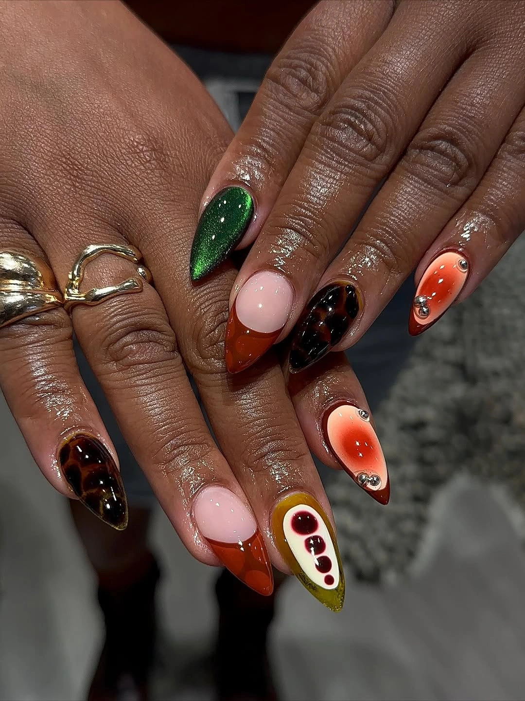 fall dark nail shadow ideas 2026 Jewel Toned Tortoiseshell Stiletto Nails