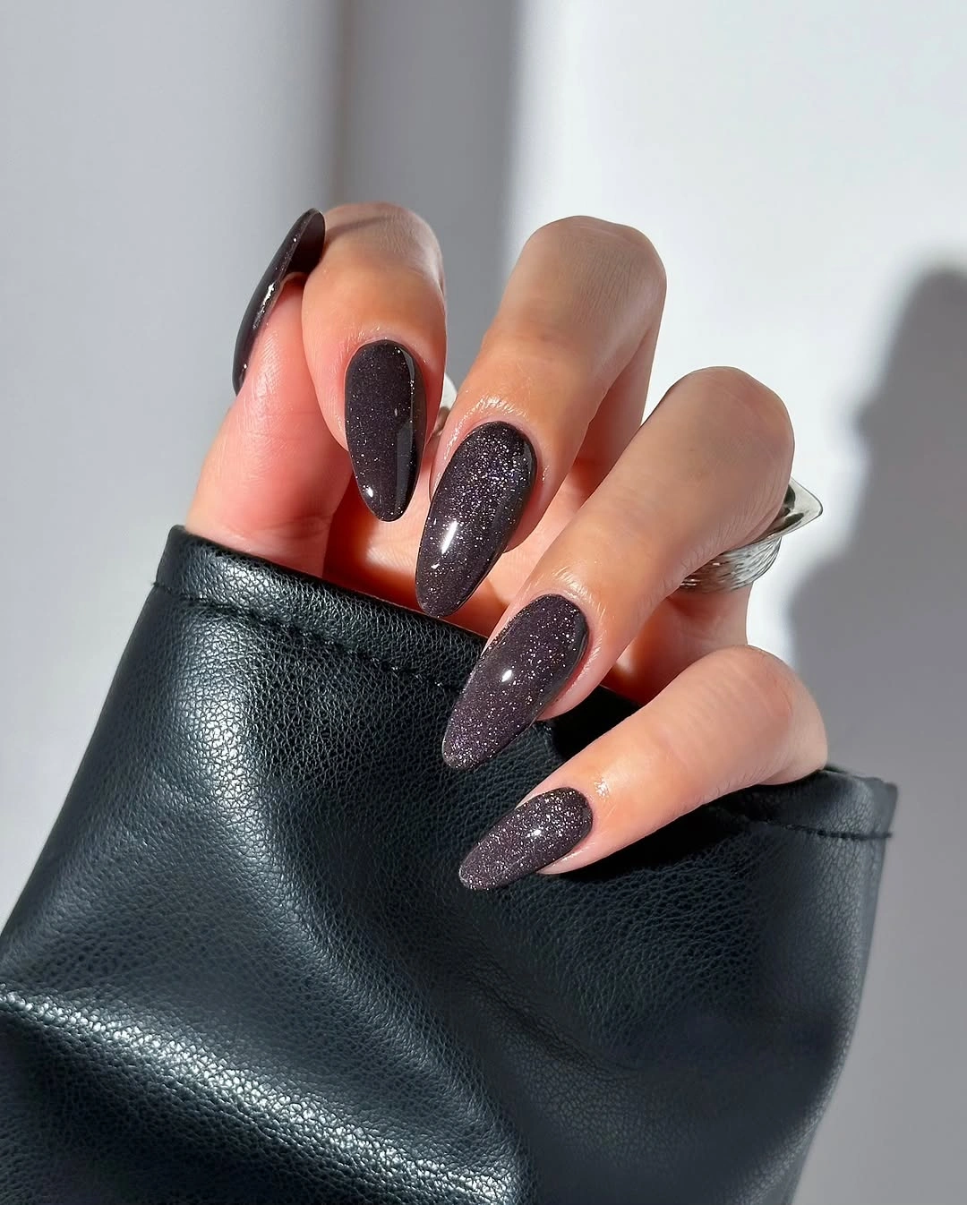 fall dark nail shadow ideas 2026 Black Sugar Almond Nails