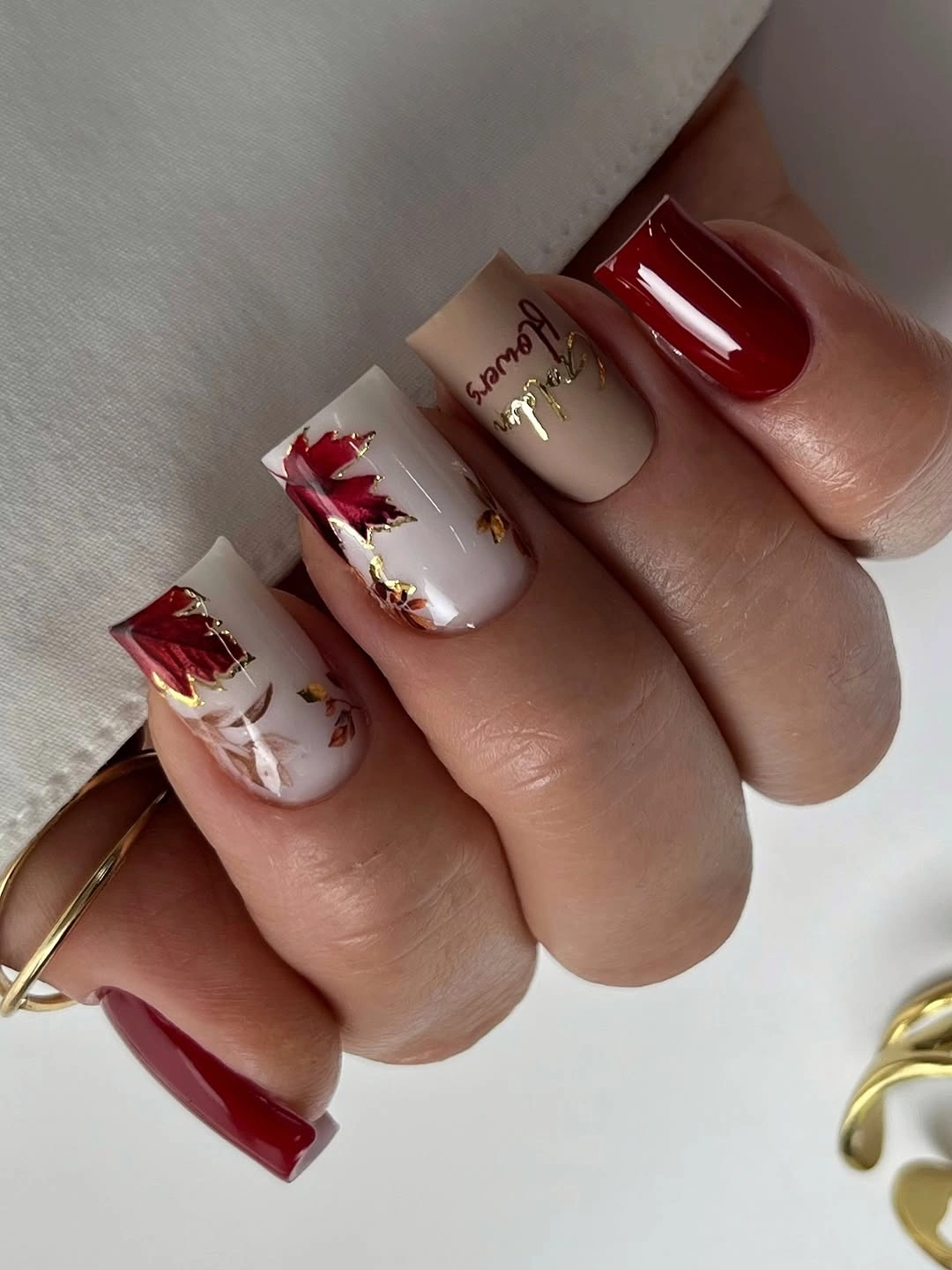Fall gel nails ideas 2026 Autumn Red And Gold Leaf Nails