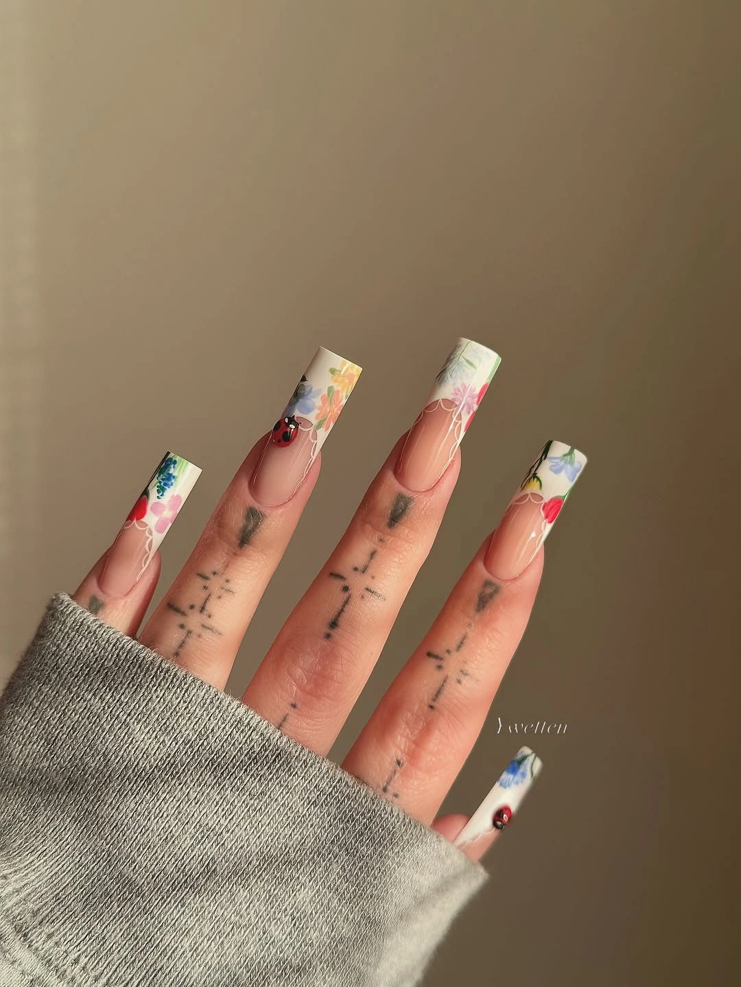 fall long nails 2026 Floral French Nails With Tiny Ladybugs