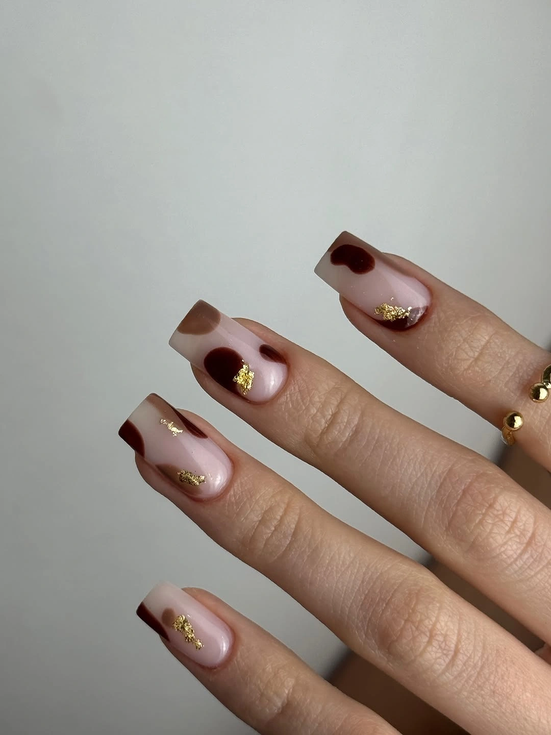 fall nail art ideas 2026 Chocolate Abstract Nails With Gold Leaf