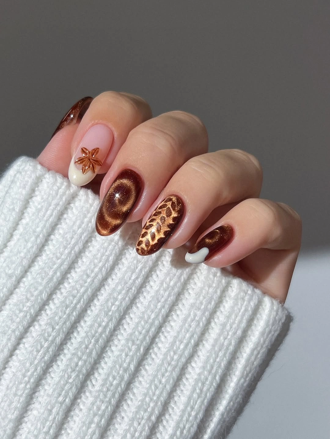 fall nail art ideas 2026 Chocolate Cat Eye and Sculpted Autumn Details