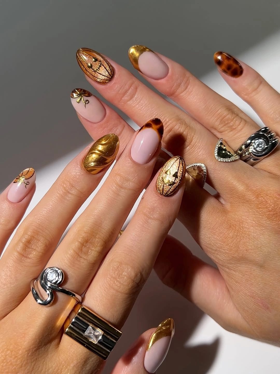 fall nail art ideas 2026 Molten Gold and Tortoiseshell Almond Nails