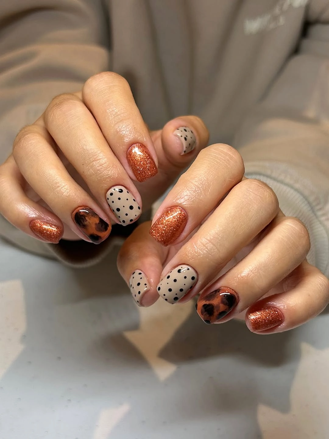 fall nail trends 2026 Copper Sparkle Meets Modern Neutrals
