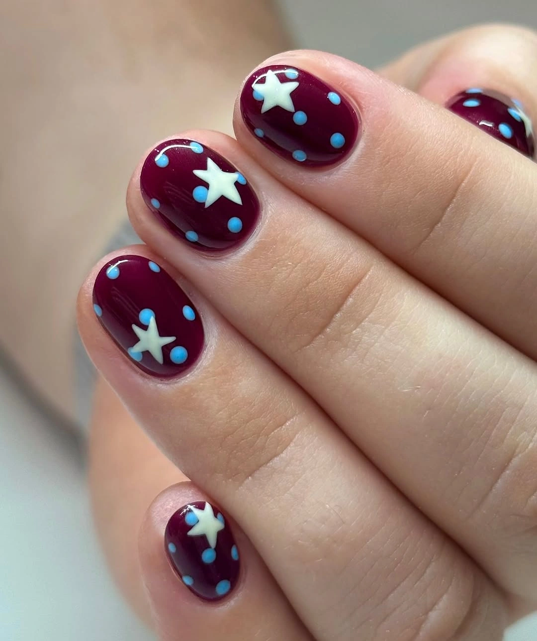 fall nail trends 2026 Deep Red Nails With Celestial Details