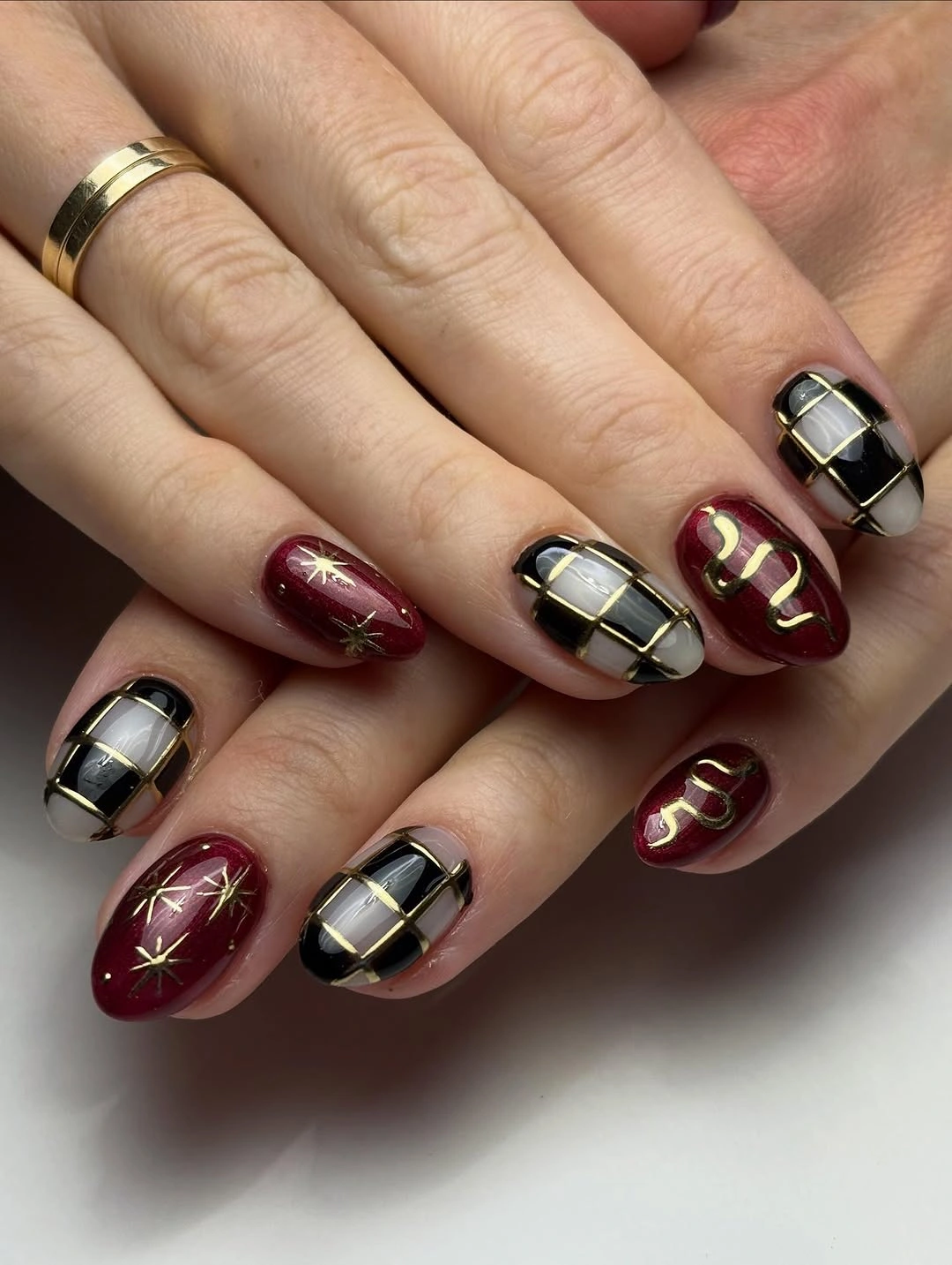 fall nail trends 2026 Burgundy Plaid With Gold Accents