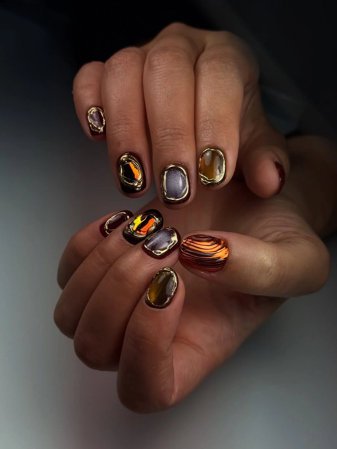 fall nails for brown skin tone Jewel-Toned Cat Eye With Molten Gold Details