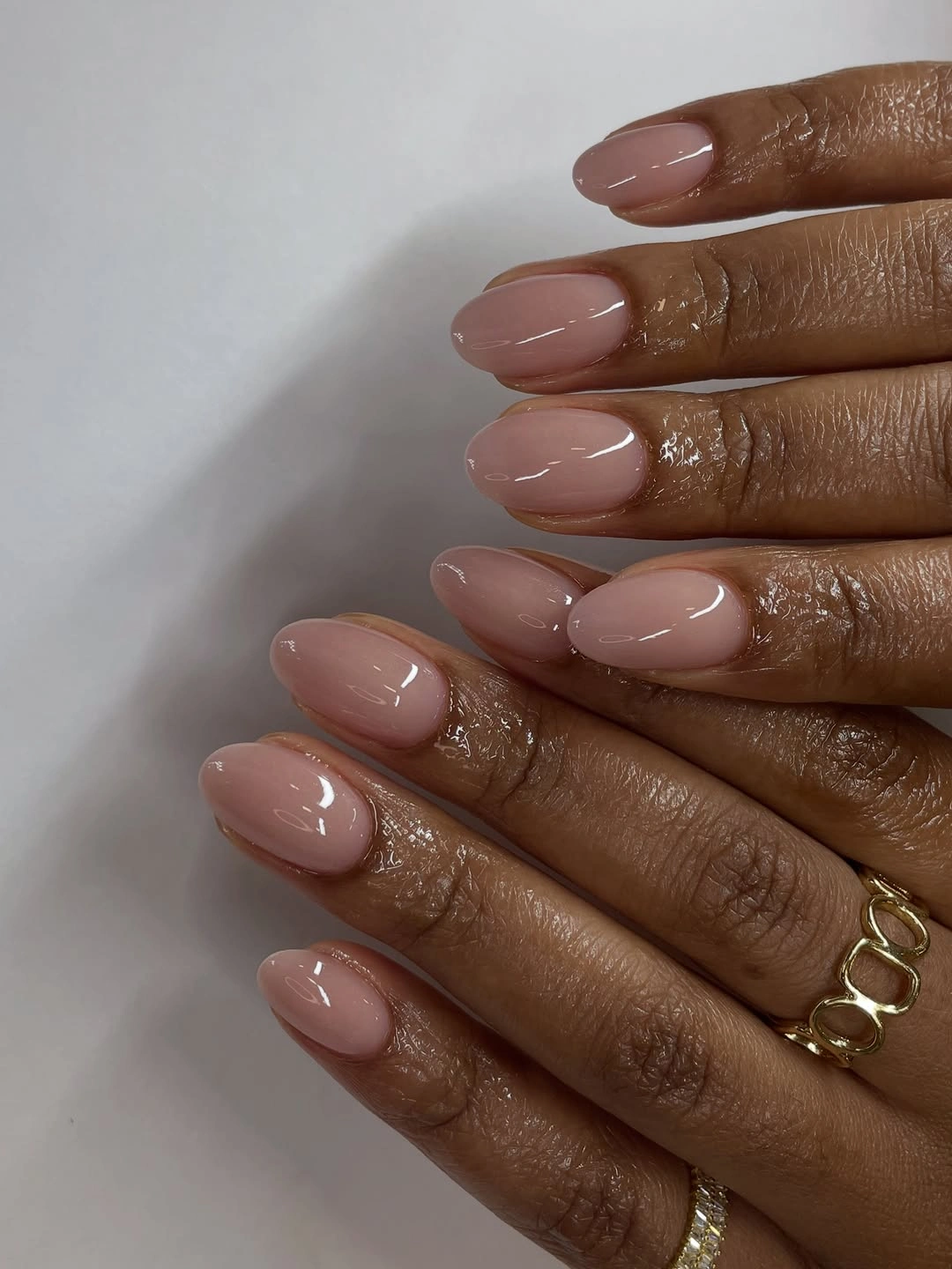 fall nails for dark skin 2026 Glossy Blush Almond Nails