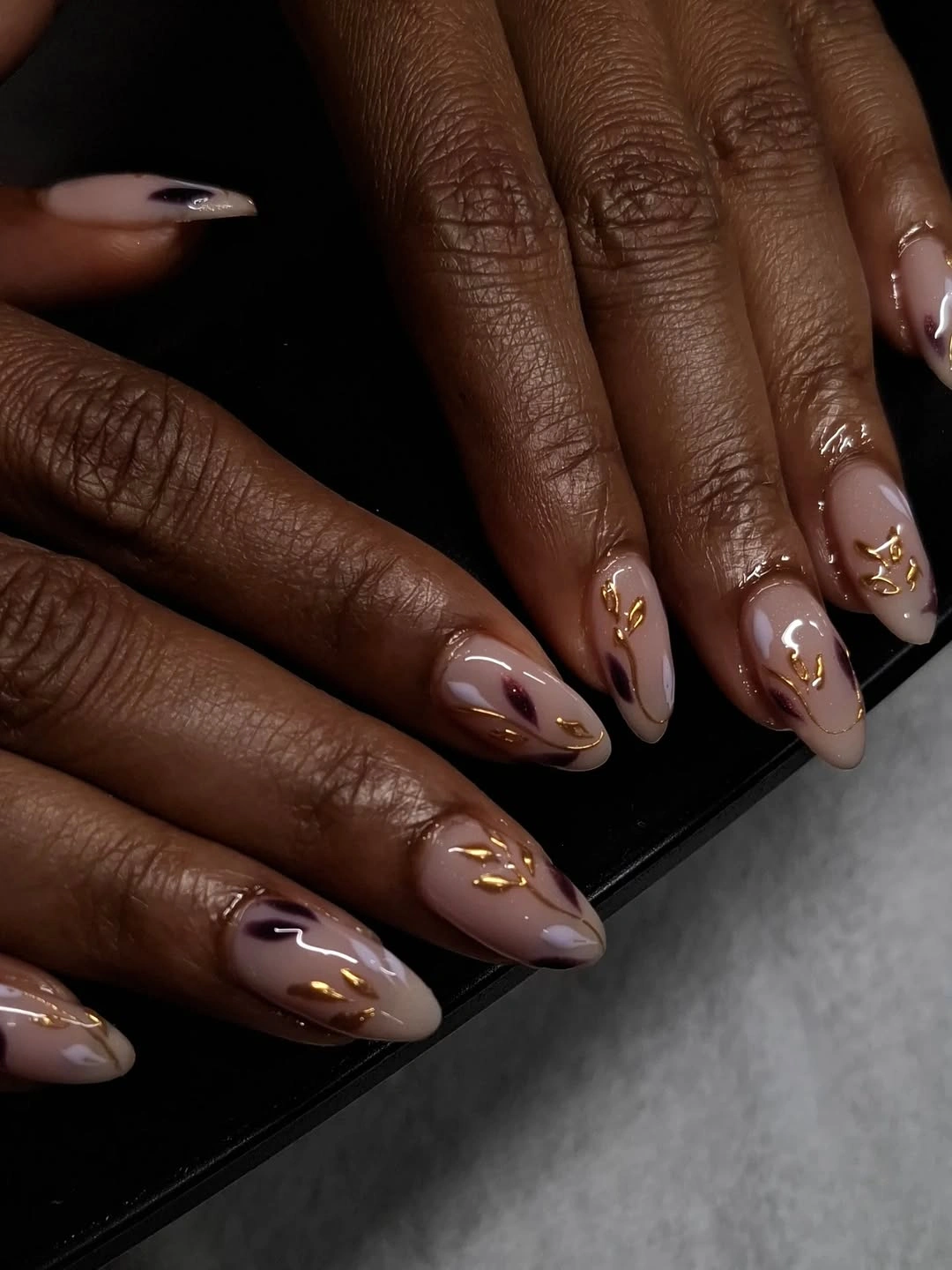 fall nails for dark skin 2026 Soft Nude Nails With Golden Botanical Details