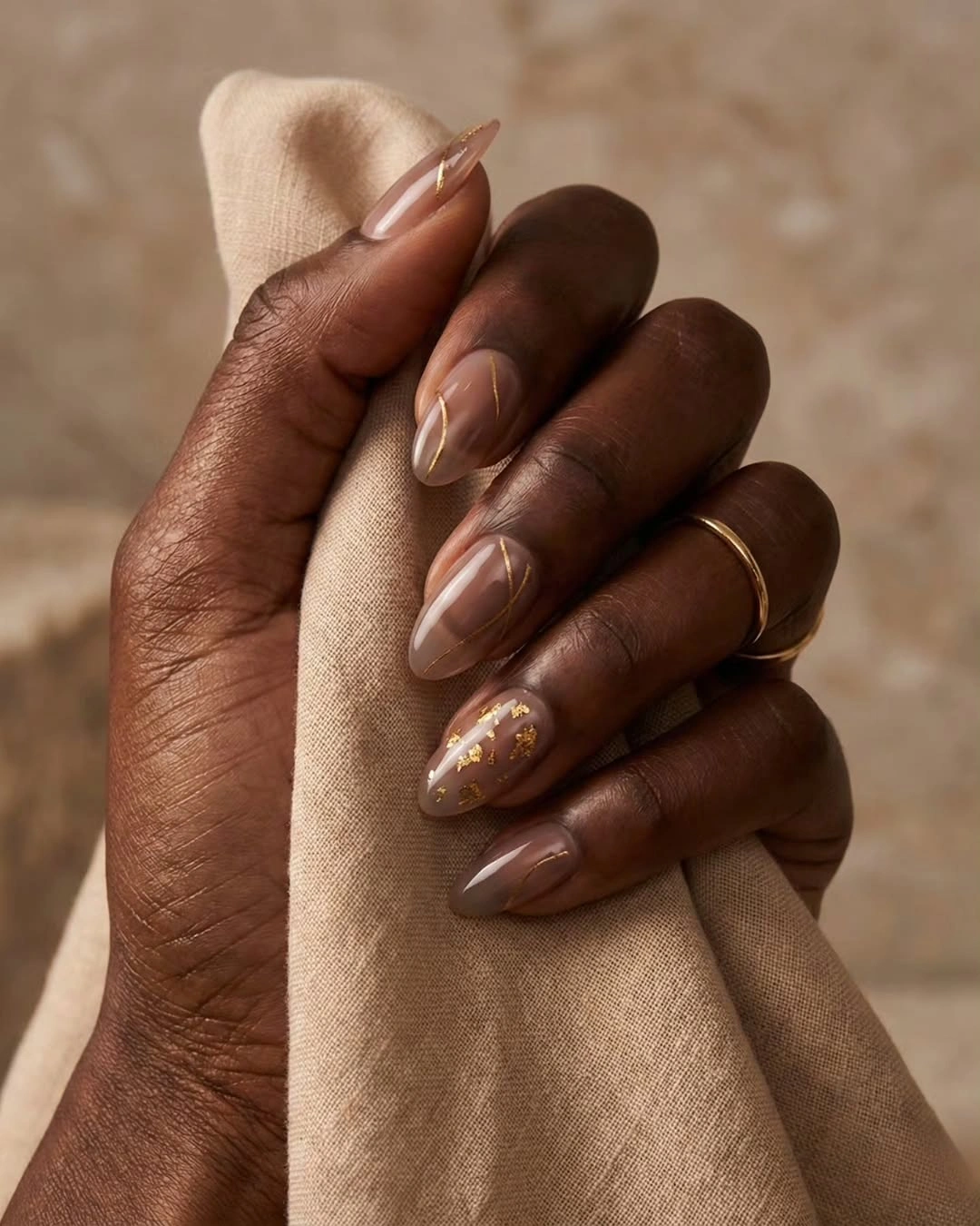 fall nails for dark skin 2026 Elegant Taupe Nails With Gold Lines