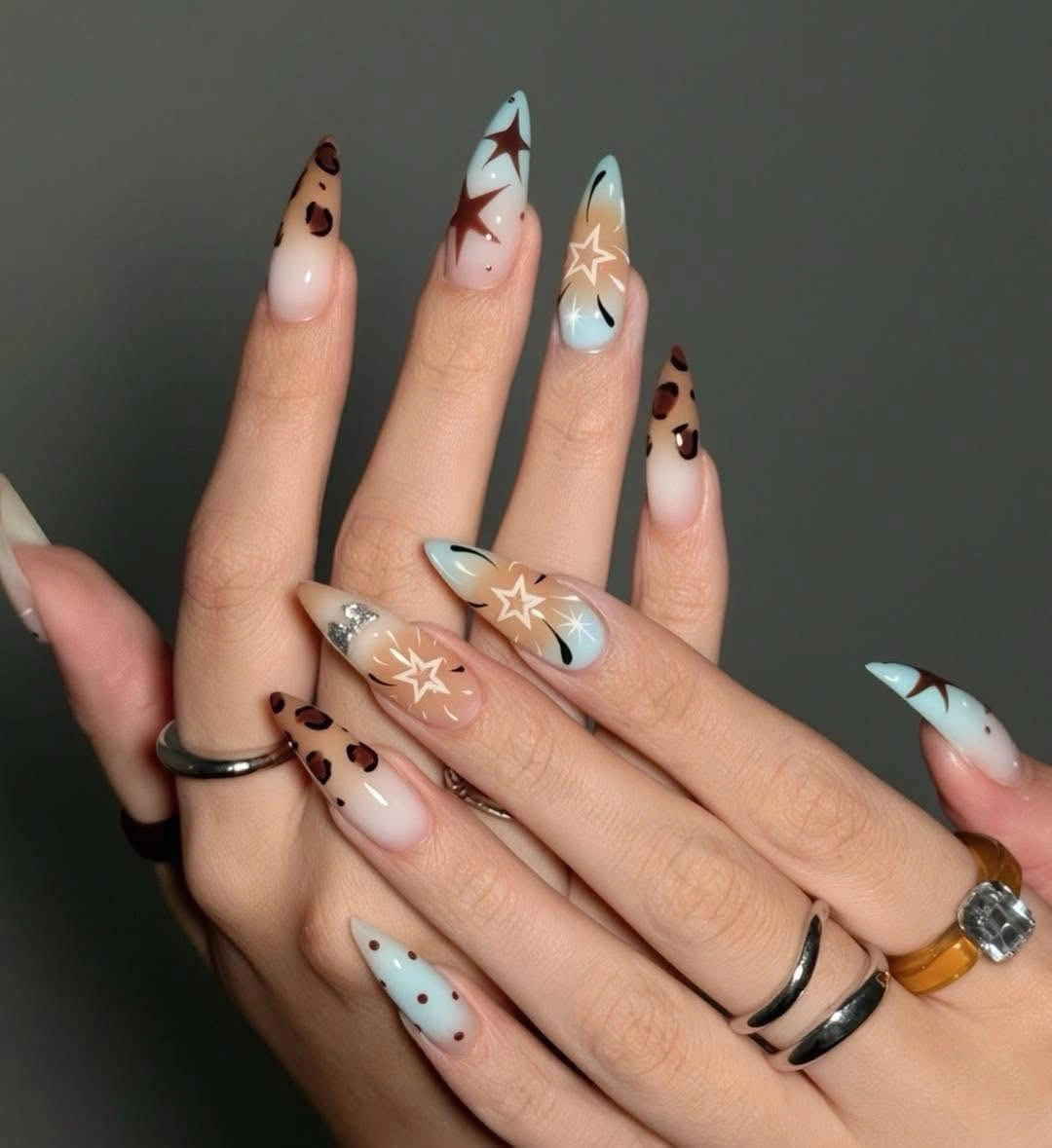 fall nails for pale skin 2026 Celestial Brown and Icy Blue Almond Nails