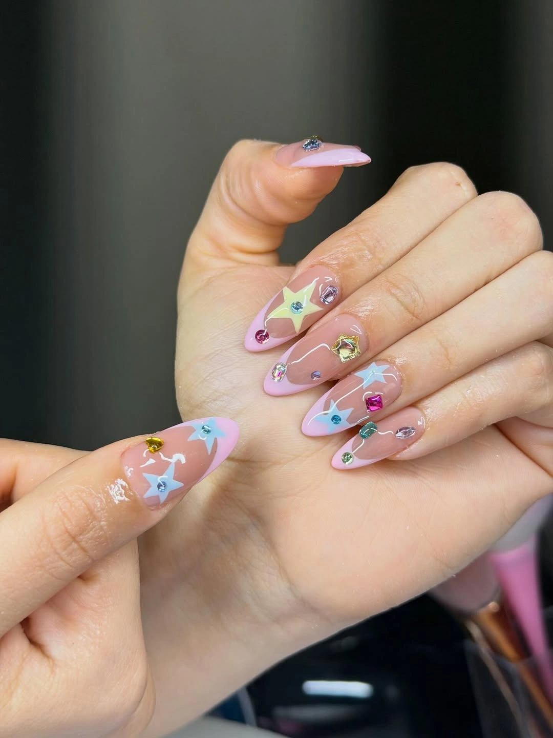fall nails for pale skin 2026 Pink Gemstone Almond Nails With Pastel Stars