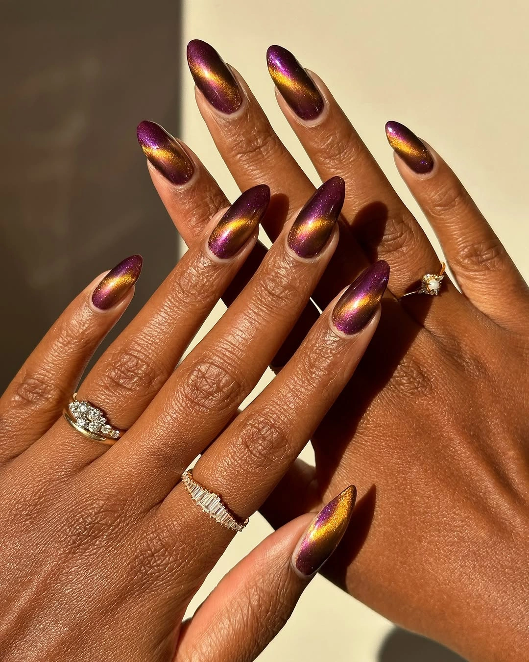 Fall nails for tan skin tone plum gold cat eye manicure