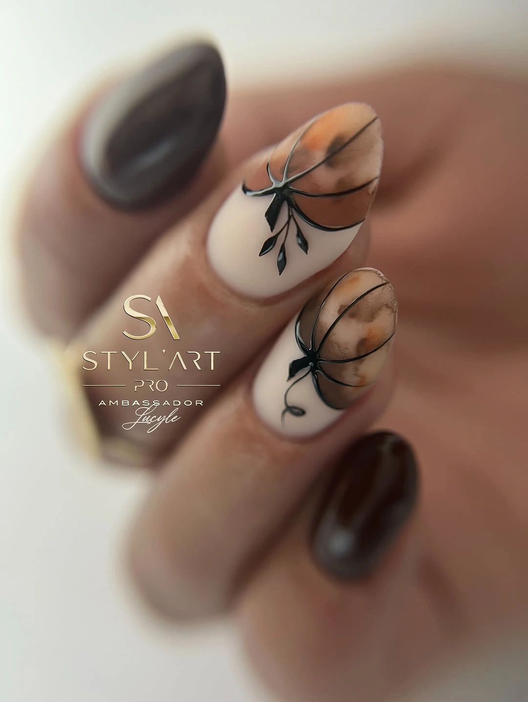 fall nails with pumpkins 2026 Moody Brown Pumpkin Tips