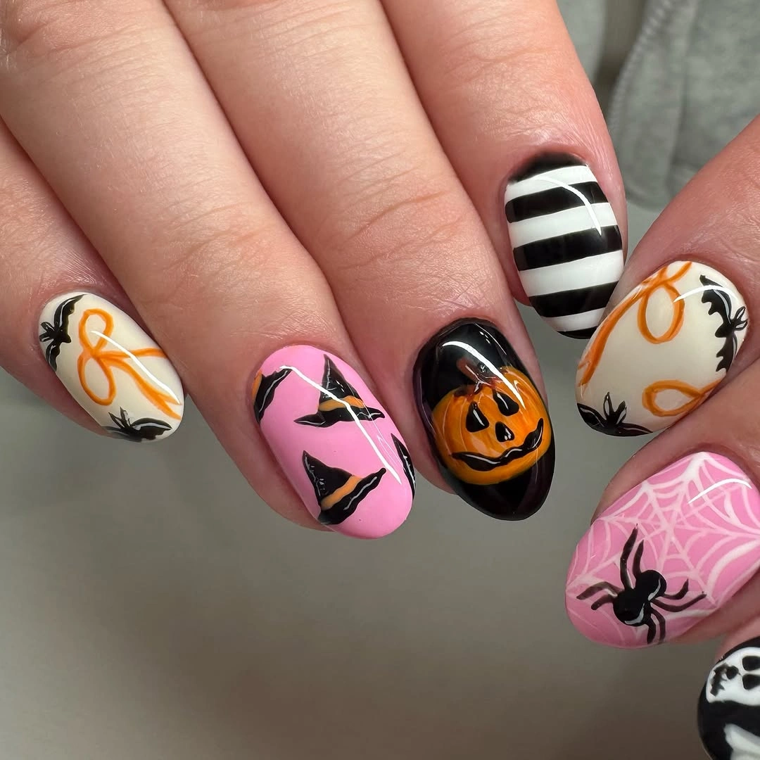 fall nails with pumpkins 2026 Playful Pink Halloween Pumpkins