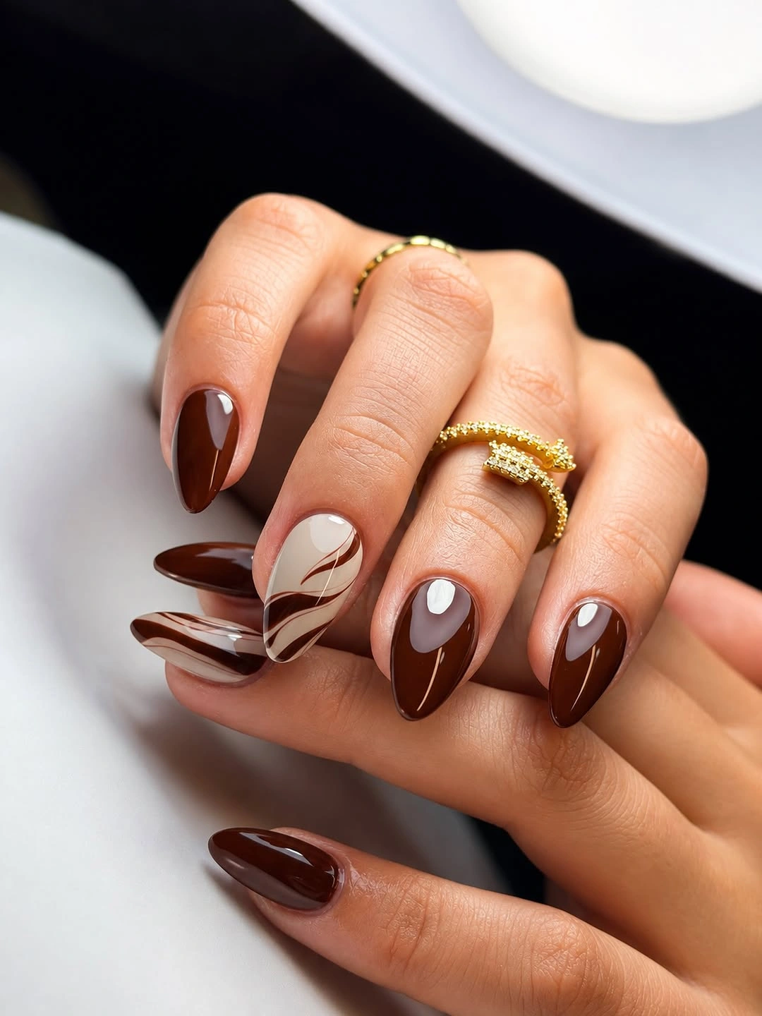 fall short almond nails 2026 Rich Chocolate Swirls For A Minimal Look