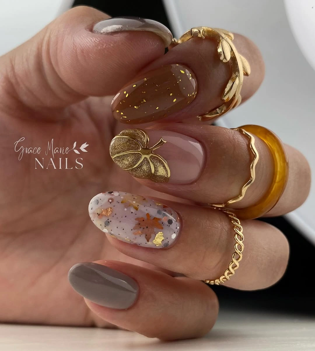 fall short almond nails 2026 Warm Neutral Nails With Golden Autumn Details