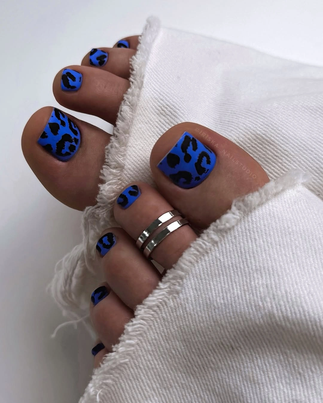 fall toe nails colors 2026 Electric Blue Leopard Pedicure
