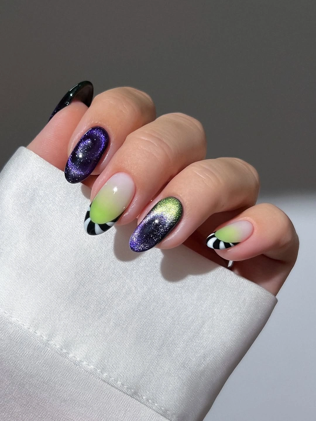 halloween nail art 2026 Purple Galaxy Cat Eye Tips