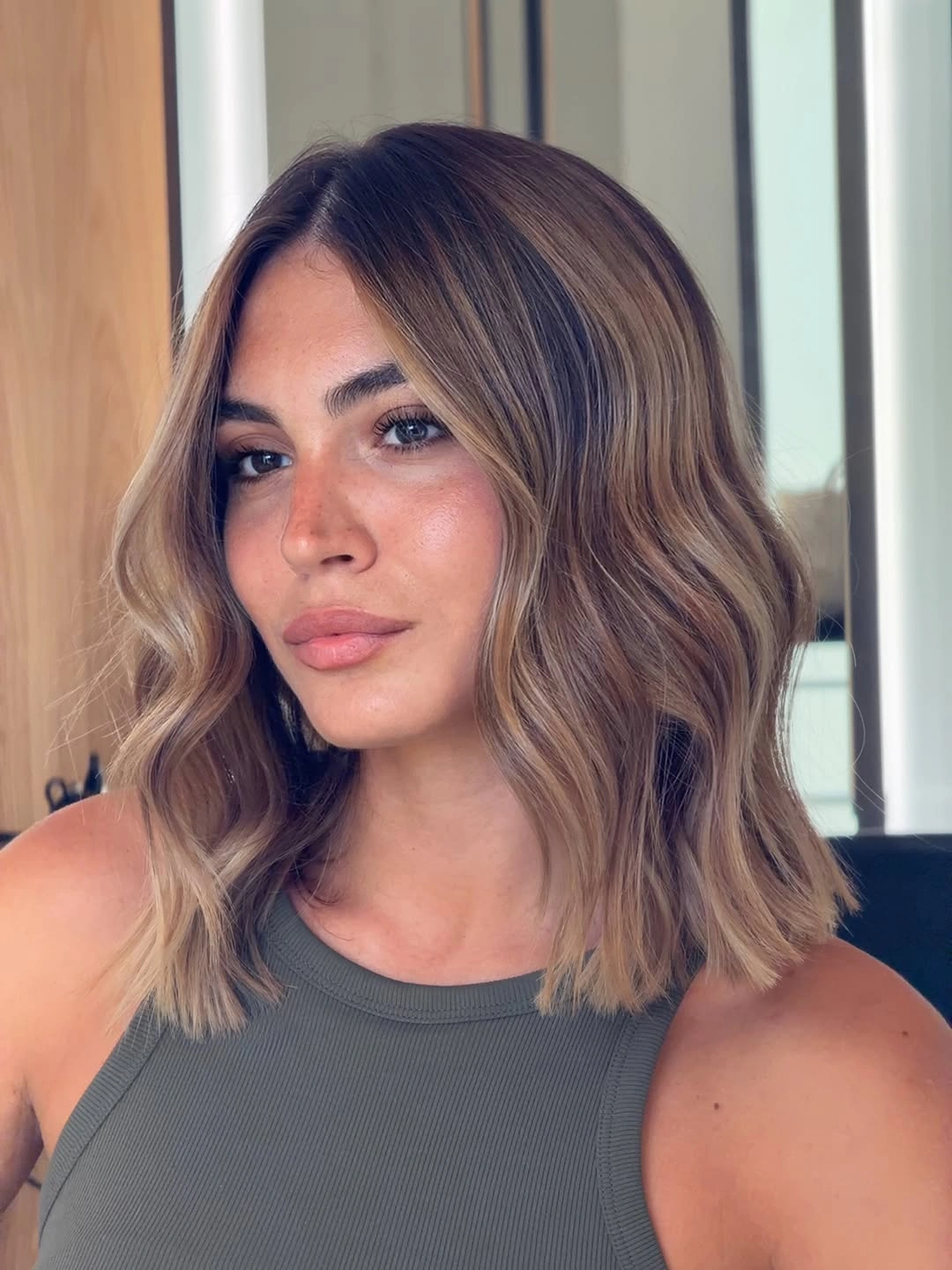 lob haircut ideas Brunette Wavy Lob With Caramel Ribbons