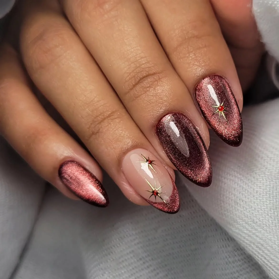 maroon fall nails 2026 Burgundy Glitter Cat Eye Almond Nails