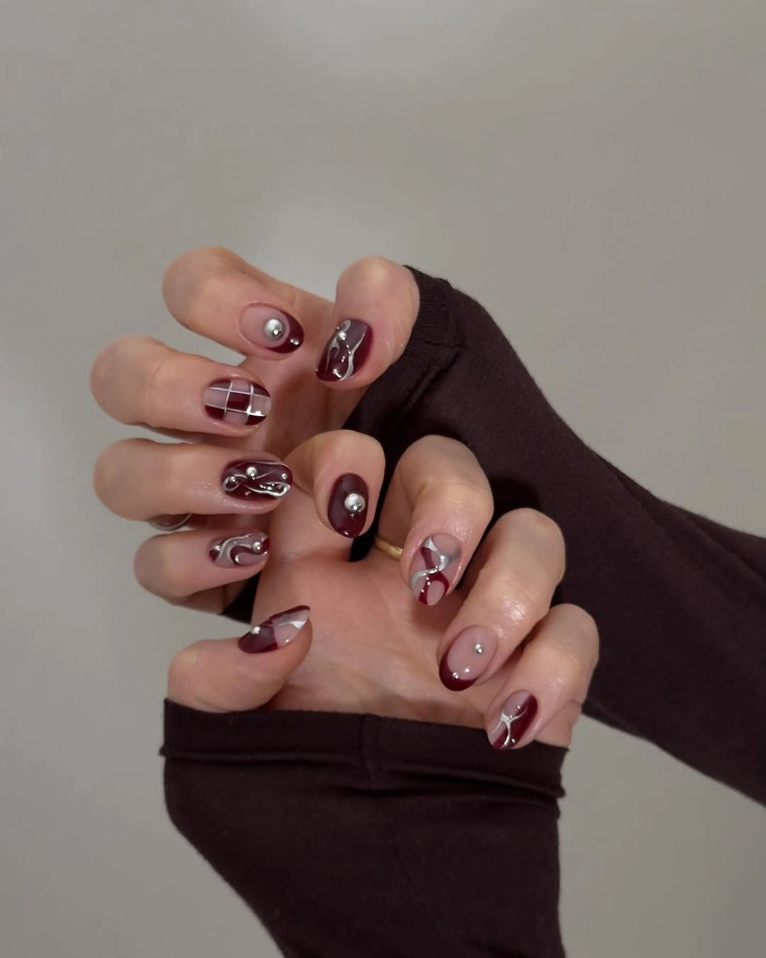 maroon fall nails 2026 Maroon Nails With Sculptural Silver Art