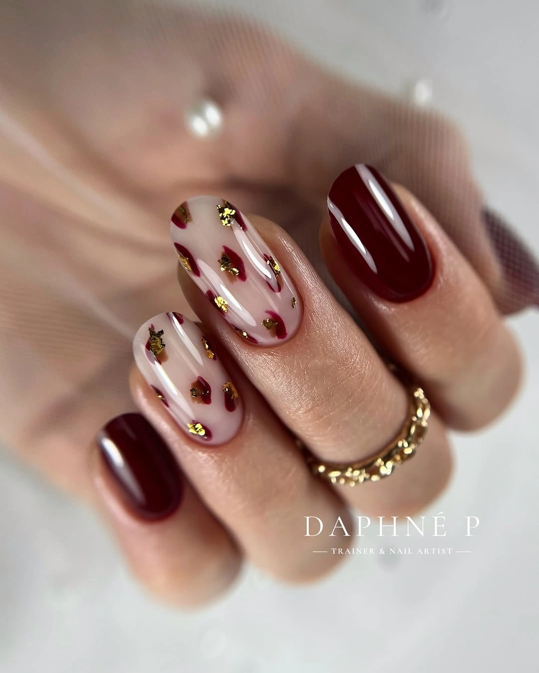 maroon fall nails 2026 Burgundy Gold Flecks on Milky Nails