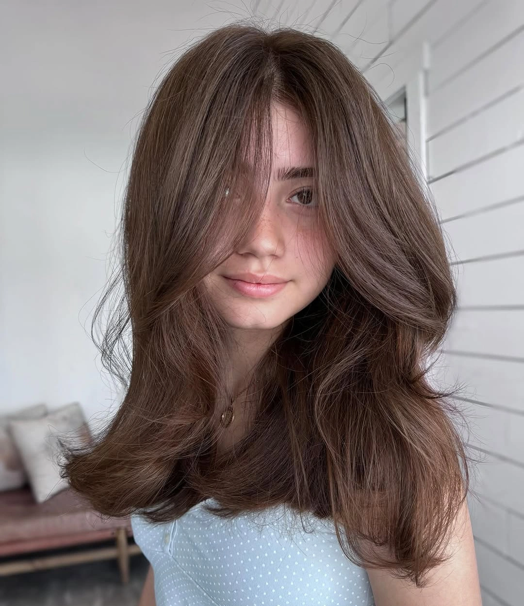 middle parting hairstyles Voluminous Layered Waves With Face Framing Movement