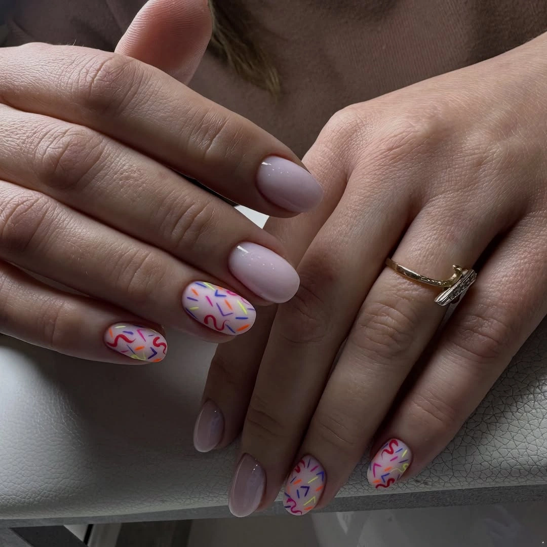 nude fall nails 2026 Playful Sprinkles on Soft Nude Nails
