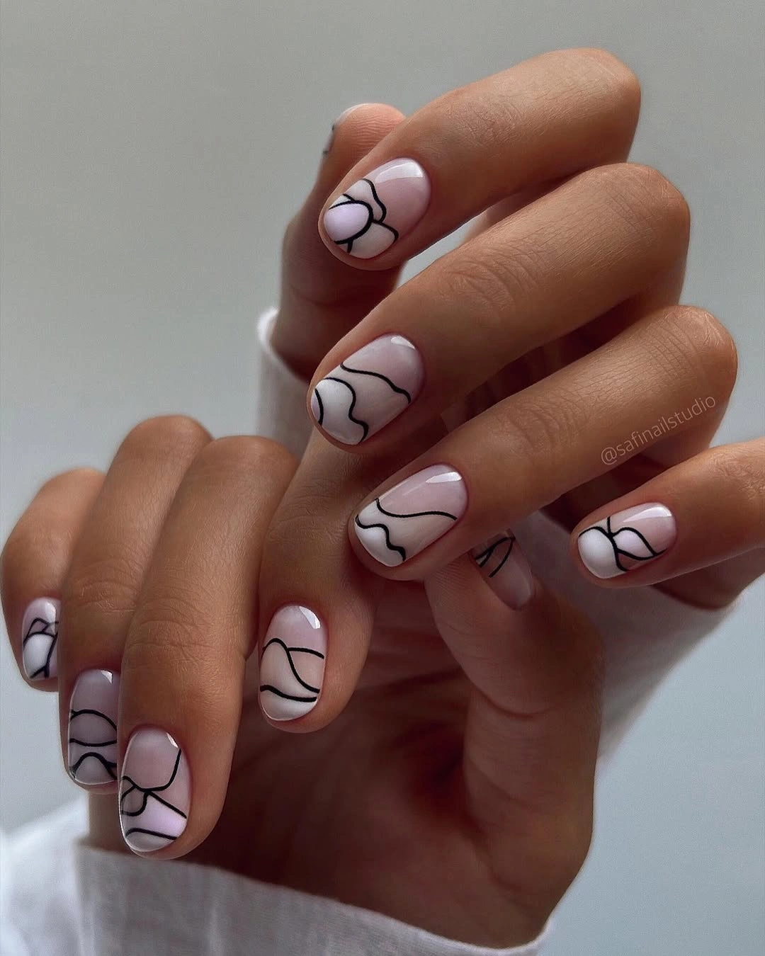 nude fall nails 2026 Blush Nude Nails With Abstract Black Lines